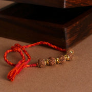 Rudraksha Golden Rakhi Pratha - Jewellery Studio