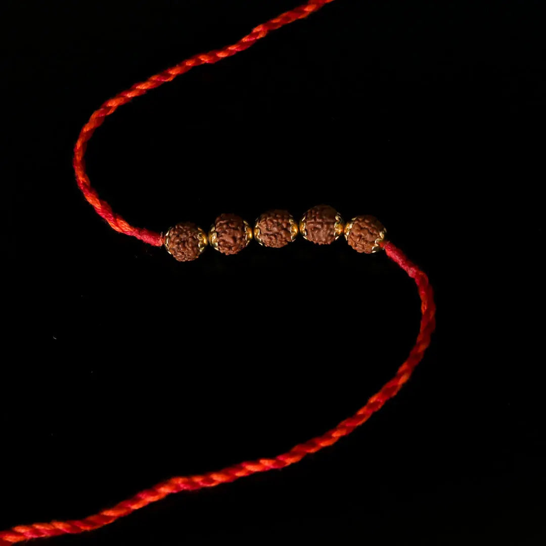 Rudraksha Golden Rakhi Pratha - Jewellery Studio