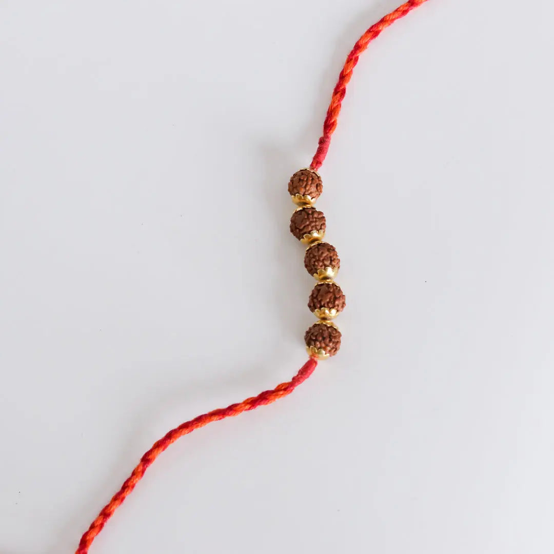Rudraksha Golden Rakhi Pratha - Jewellery Studio